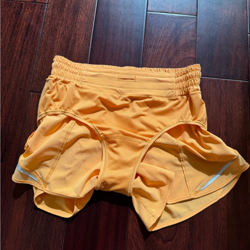 Selling Lululemon shorts size 6 in orange color - Picture 9 of 9